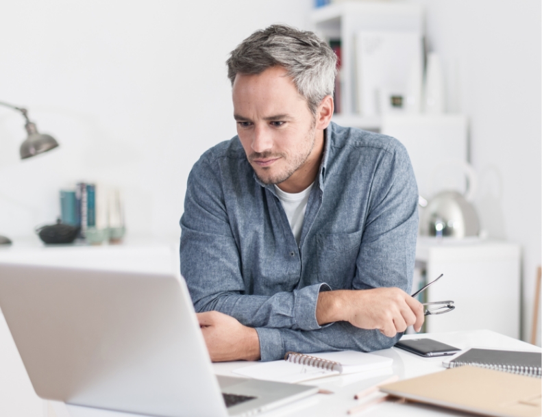 man watching in laptop